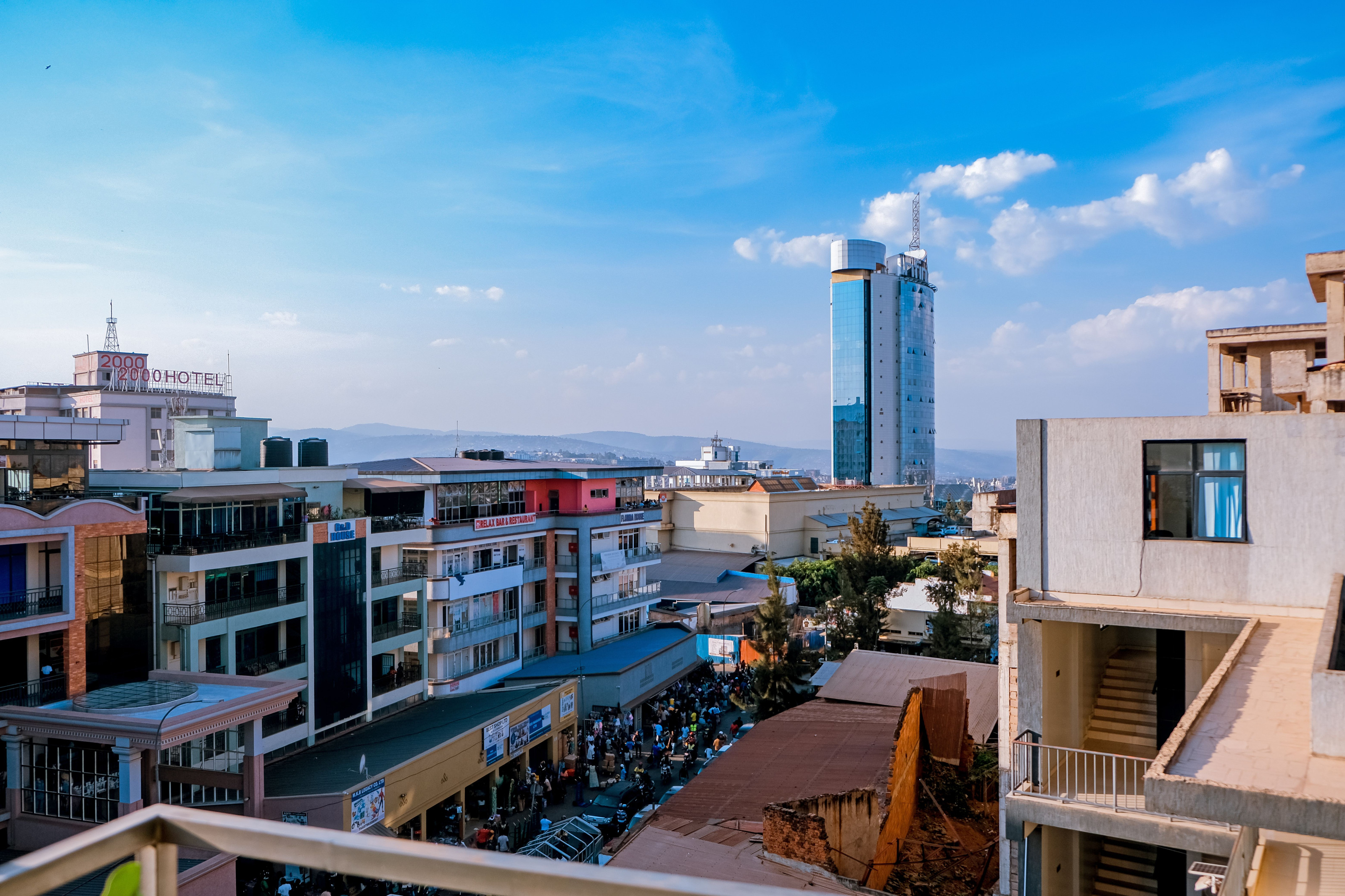 Modern buildings rise in downtown Kigali, showing the city's ongoing urban growth.
